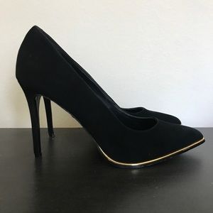 Black high heels with gold details